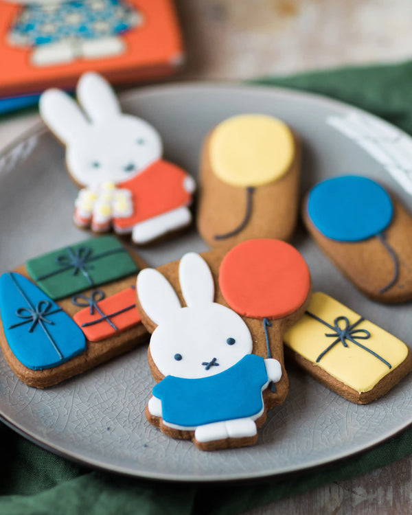 Honeywell Bakes Miffy Birthday Biscuit Gift Set - Decorative cookies shaped like bunnies and gift boxes on a plate.