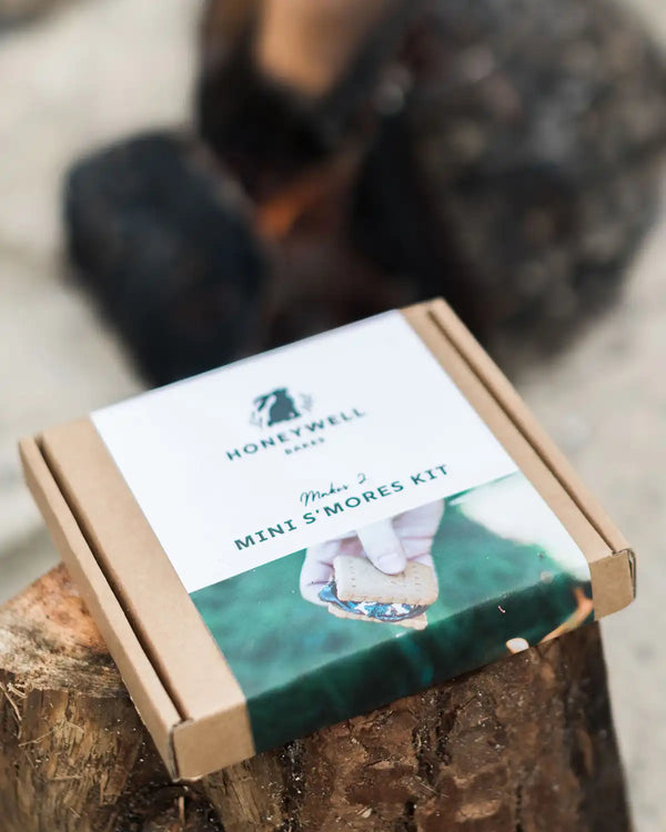 Honeywell Bakes Mini S’mores Kit packaging on a wooden surface with a blurred background