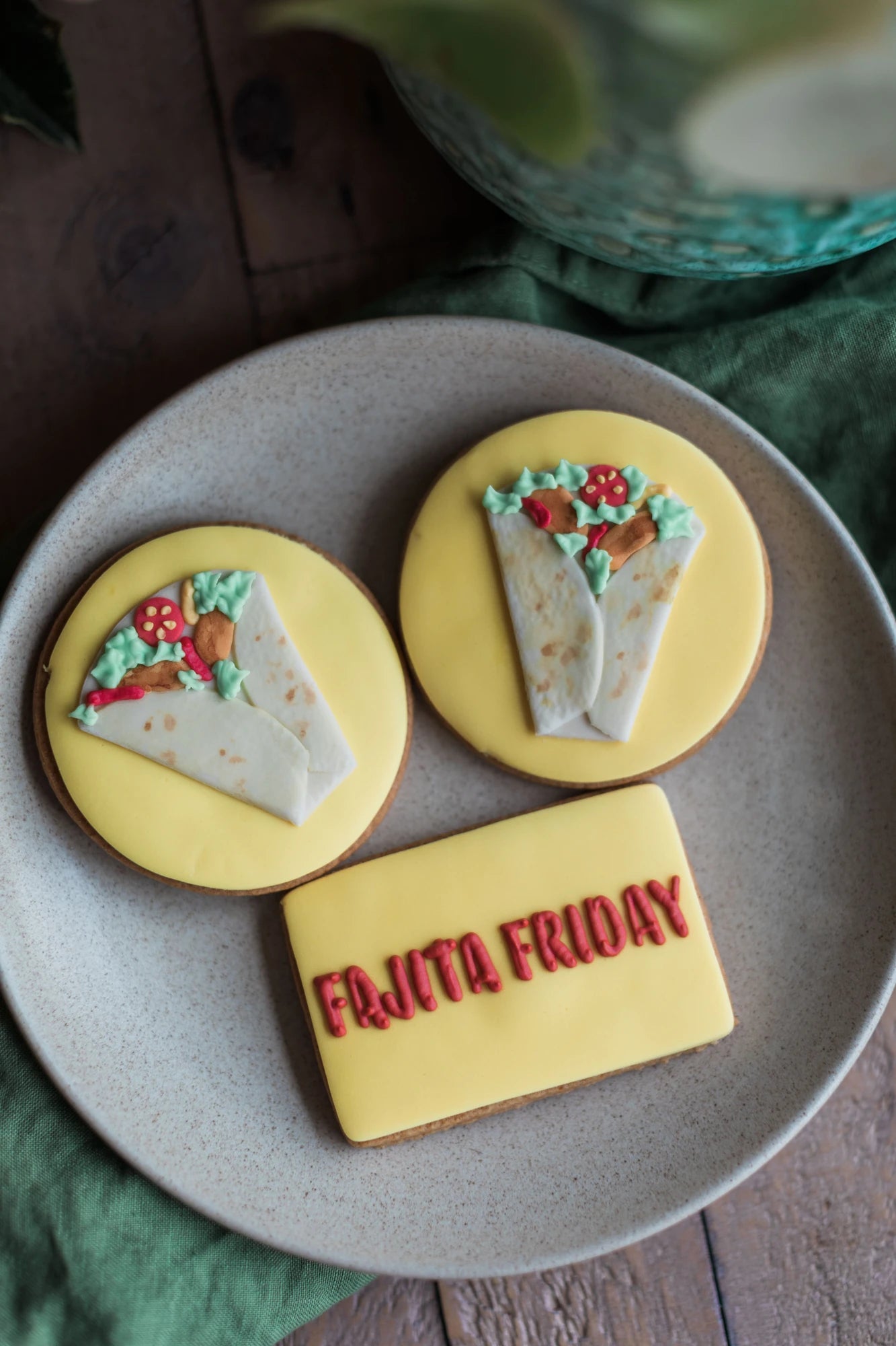 Honeywell Bakes bespoke sugar cookies shaped like tacos and a burrito with red branded icing text reading 'FAJITA FRIDAY' for Old El Paso