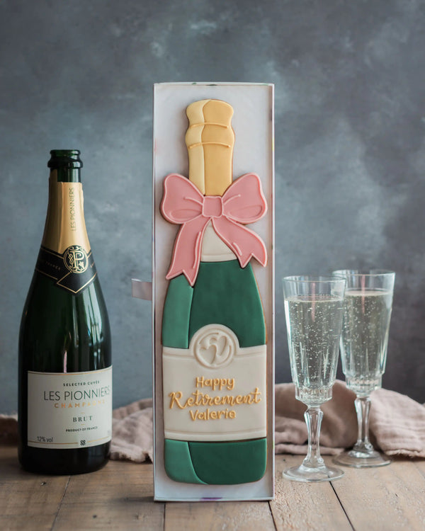 Honeywell Bakes Personalised Champagne Biscuit Bottle - Green - Large celebration champagne bottle biscuit personalised next to a real sized champagne bottle