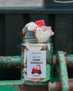Honeywell Bakes Personalised Jar of Farm Animal Biscuits - Jar of farm animal-shaped biscuits with a label on a rustic background