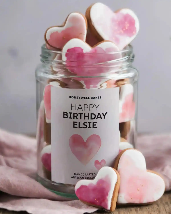 Honeywell Bakes Personalised Jar of Heart Biscuits - Jar of heart-shaped cookies with a personalised label on a soft pink background