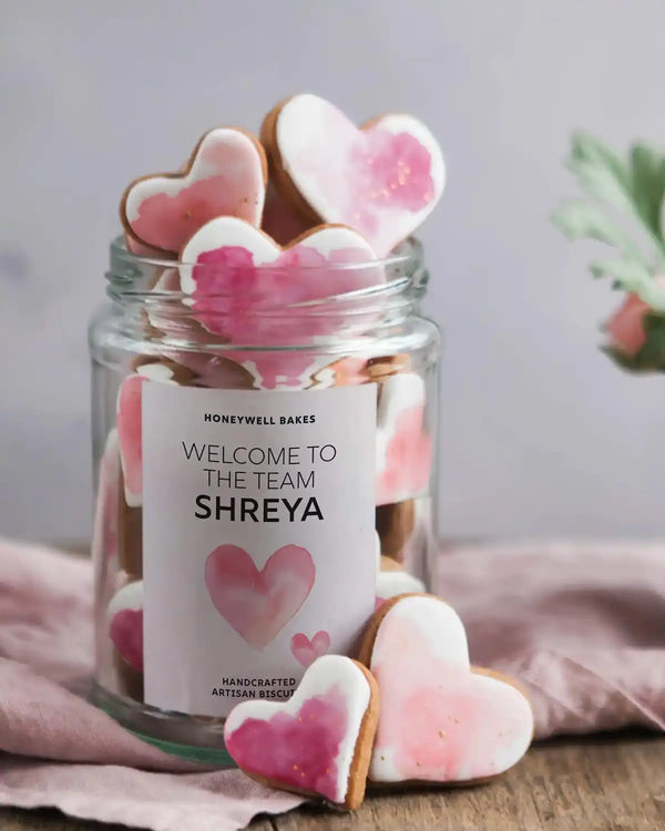 Honeywell Bakes Personalised Jar of Heart Biscuits - Jar of heart-shaped cookies with a personalised label on a wooden surface.