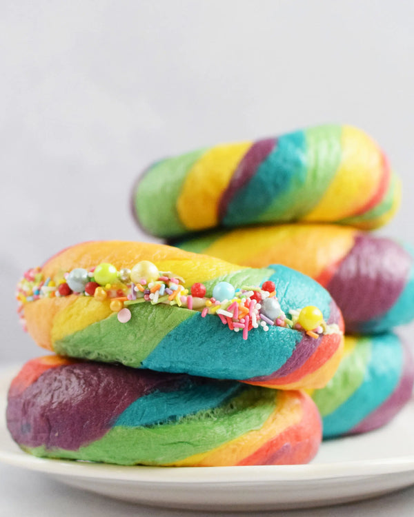Honeywell Bakes Rainbow Bagel Bread Kit Colourful bagels on a plate with sprinkles