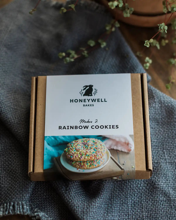 Honeywell Bakes Rainbow Sprinkle Cookie Kit Box on a textured surface with plants in the background