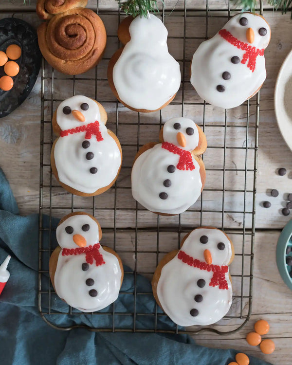 Christmas snowman cinnamon rolls served as a festive family bake