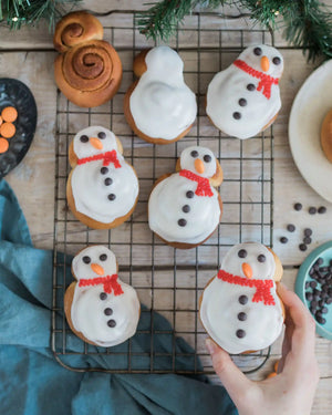 Snowman cinnamon roll baking kit with eight decorated Christmas snowman rolls