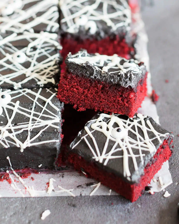 Honeywell Bakes Spooky Traybake Baking Kit - Red velvet brownies with white chocolate drizzle on a gray surface