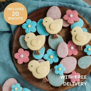 Jar of hand iced biscuits, decorated in pastel shades with chicks, flowers and eggs