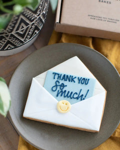 Honeywell Bakes Thank You Biscuit - Cookie shaped like an envelope with a 'Thank you so much!' message on a plate.