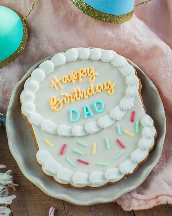 Honeywell Bakes The Big Birthday Biscuit - Cookie with 'Happy Birthday Dad' text on a plate