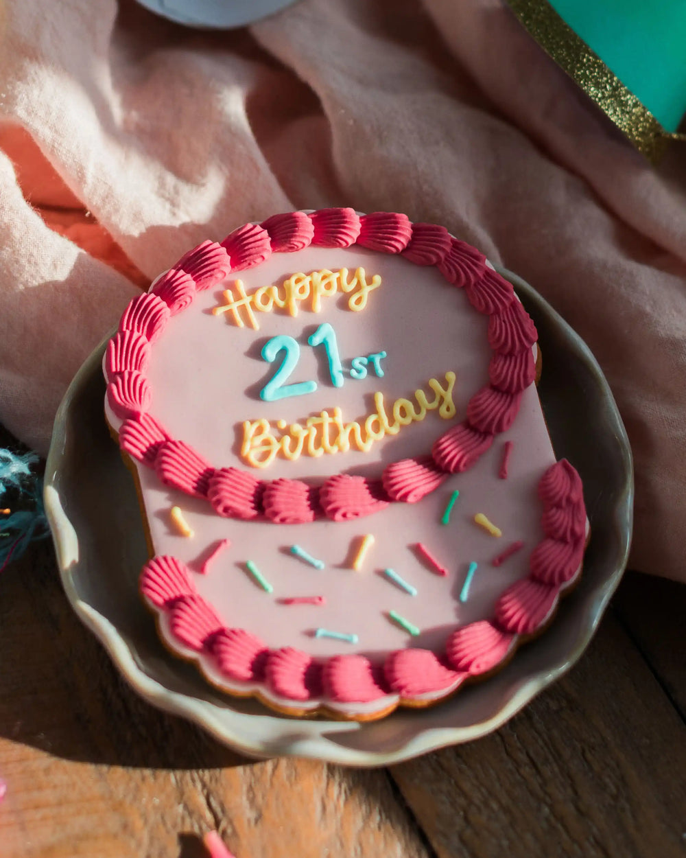 Honeywell Bakes The Big Birthday Biscuit - Pretty In Pink - Cookie with 'Happy Birthday Alex' icing on a plate