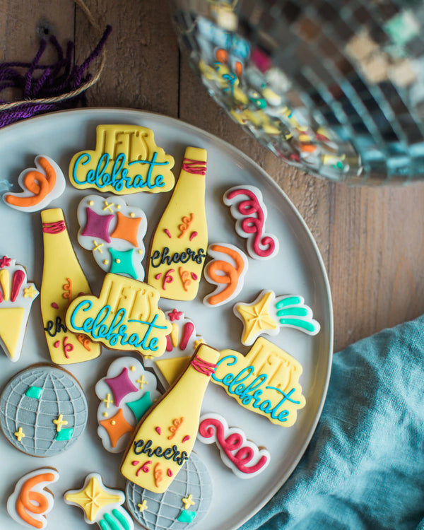 Honeywell Bakes The Celebration Jar - Decorative cookies with celebratory text on a plate