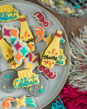 Honeywell Bakes The Celebration Jar - Decorative cookies with colorful icing on a plate