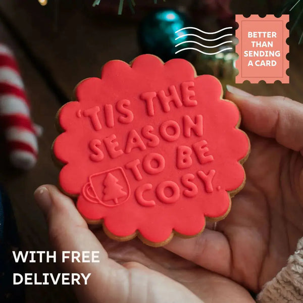 Individual iced vanilla biscuit with 'Tis the season' festive message