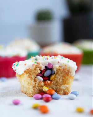 Honeywell Bakes Family Bakers Subscription, Piñata cupcake filled with chocolate beans, with icing and colourful sprinkles 