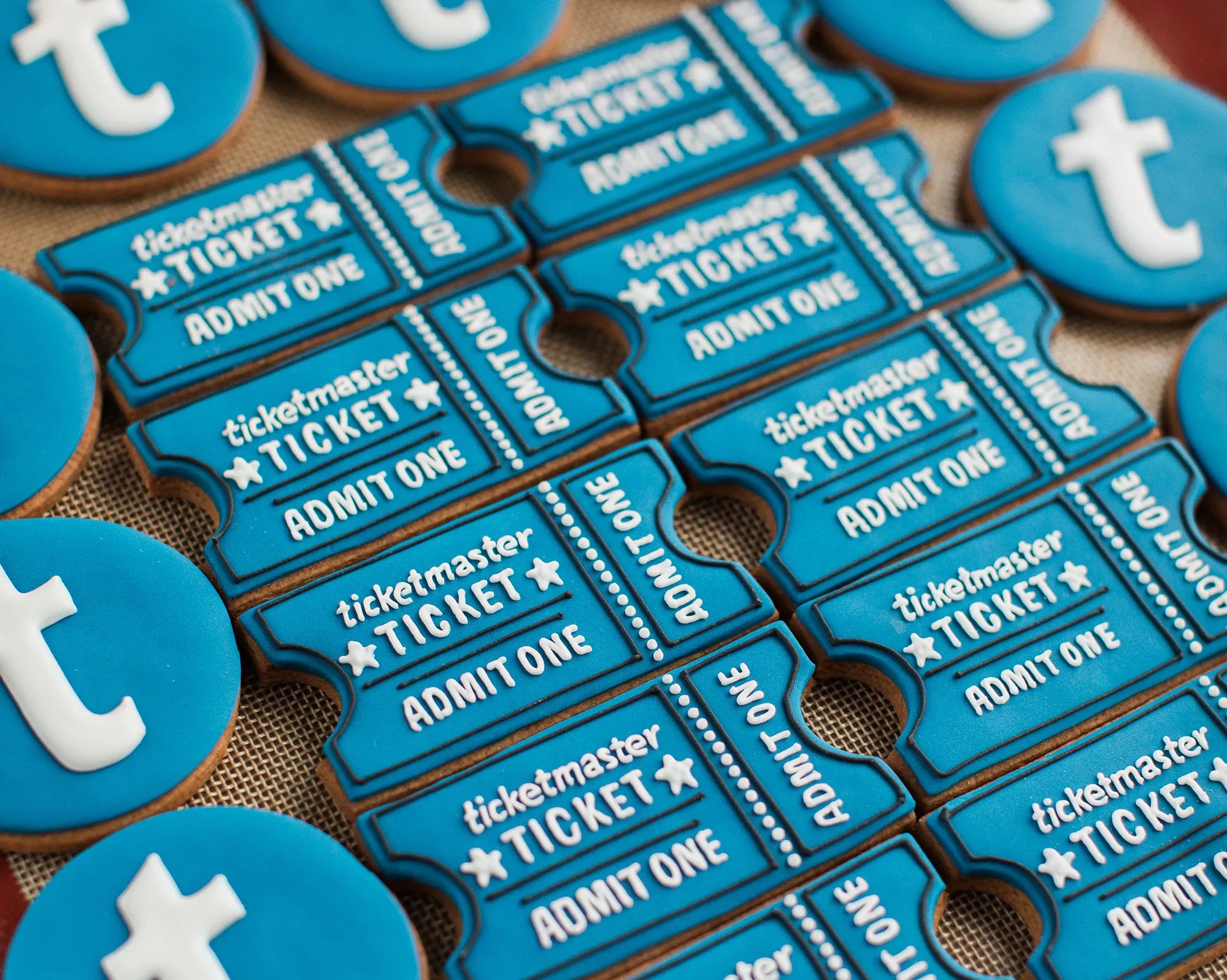 Honeywell Bakes custom shape branded biscuits, made for Ticketmaster, in the shape of tickets in brand colours